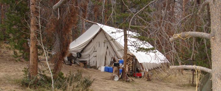 A big tent pitched in the woods of Colorado