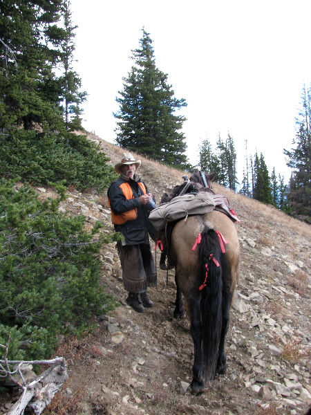 Hunter riding horseback in Colorado 